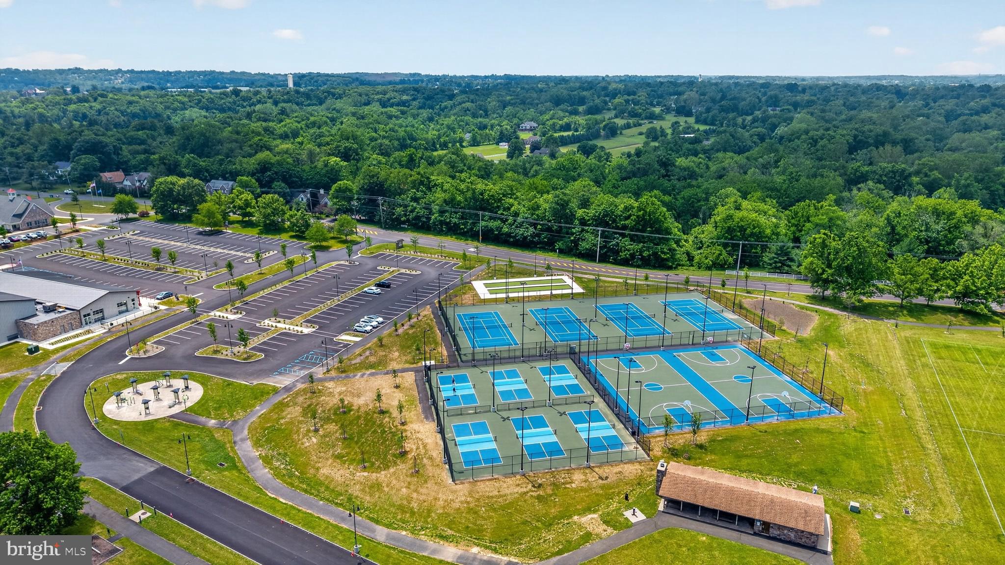 460 Wells Road Doylestown, PA 18901 - Photo 60 of 65 Vibrant tennis courts amidst nature.