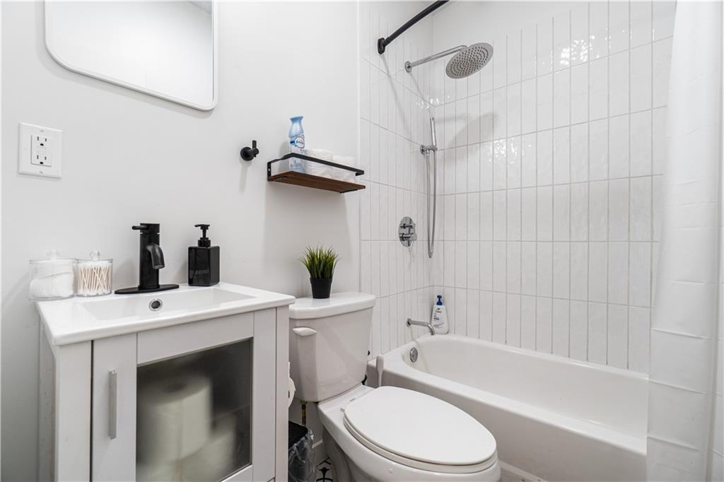 525 Alpine Avenue Pittsburgh, PA 15212 - Photo 21 of 26 Updated full bath with a clean, modern feel and fresh finishes throughout.