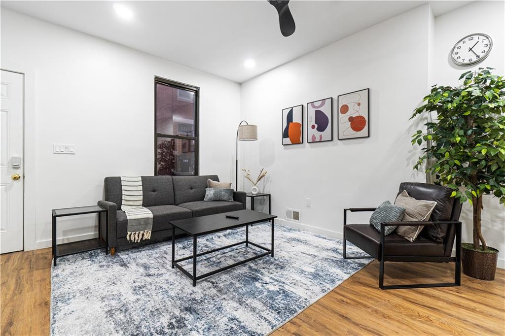 525 Alpine Avenue Pittsburgh, PA 15212 - Photo 6 of 26 Soft light, modern finishes, and an airy layout make this living room a true everyday comfort zone.