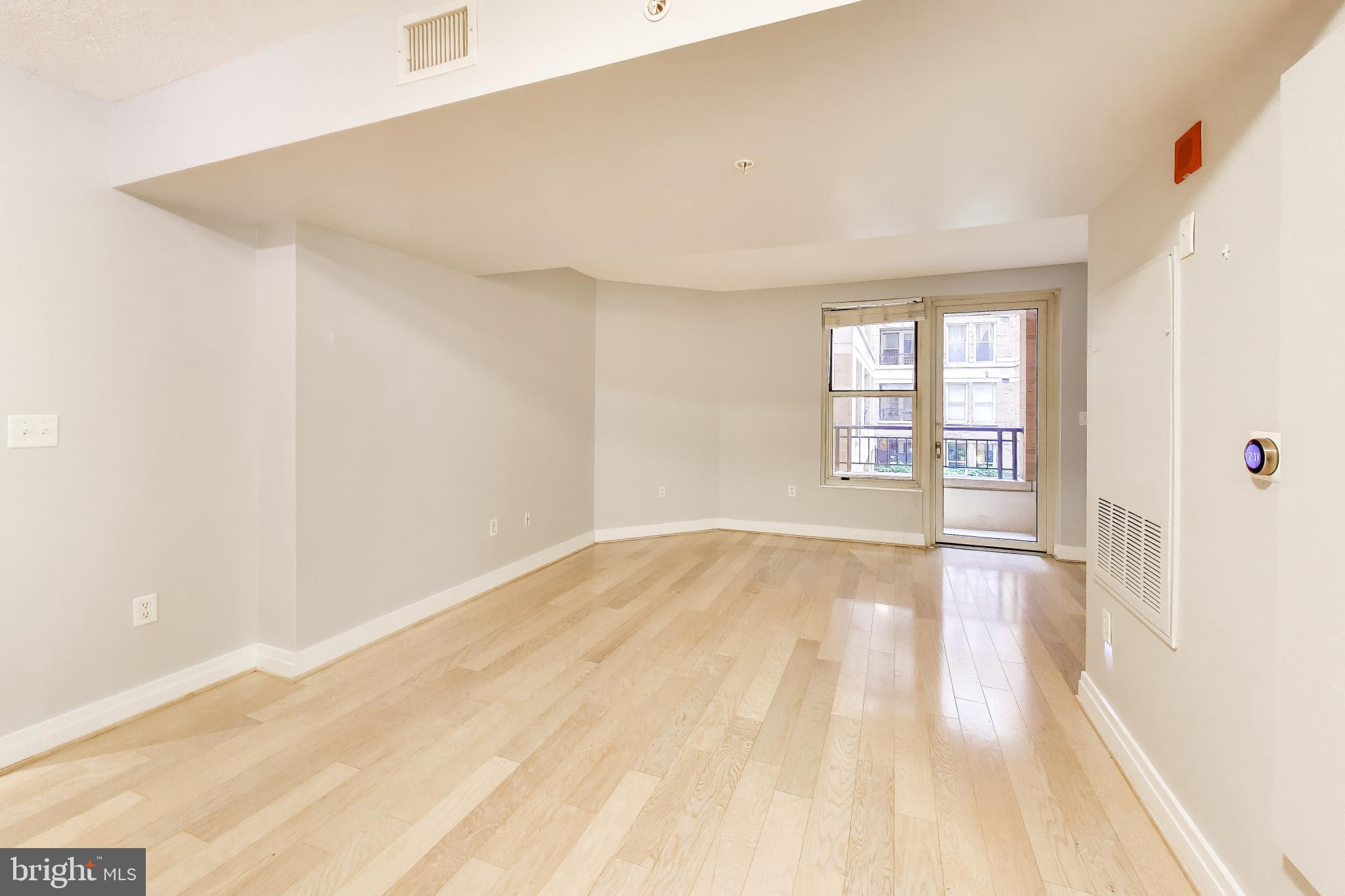 915 E Street Northwest, Unit 414 Washington, DC 20004 - Photo 7 of 35 a view of an empty room and window