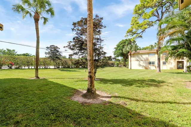 a storage room with cabinets and washer