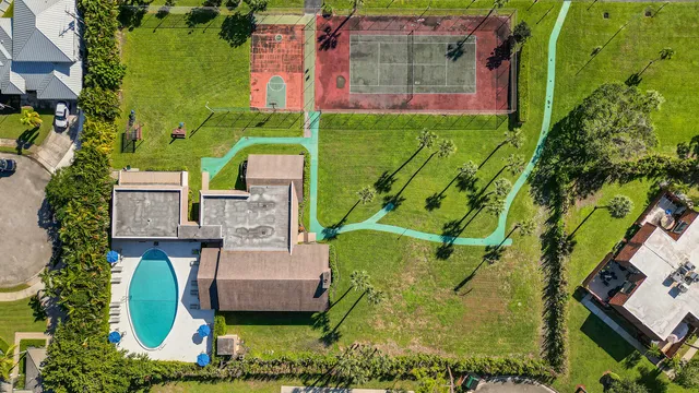 an aerial view of residential building and lake