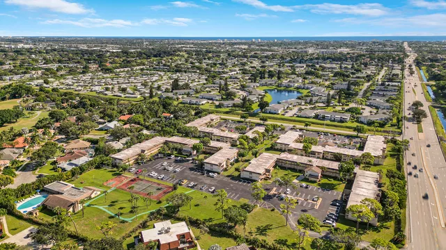 an aerial view of residential houses with outdoor space
