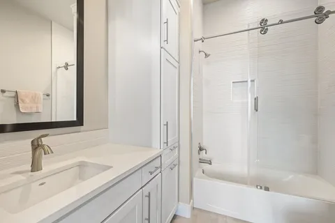 a bathroom with a bathtub and a sink