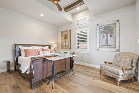 a bedroom with a bed and a couch