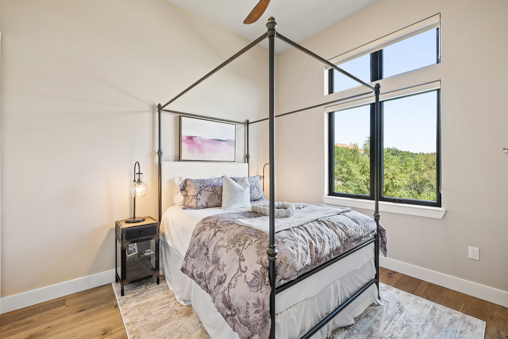 4746 R O Drive Spicewood, TX 78669 - Photo 32 of 40 a bedroom with a bed and a window