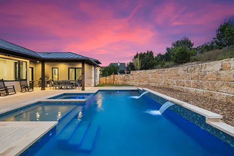 a view of a swimming pool with an outdoor seating