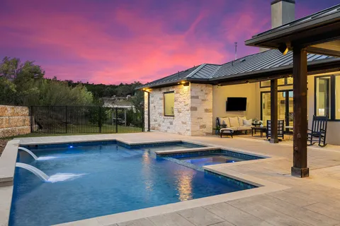a view of a patio in the backyard of house