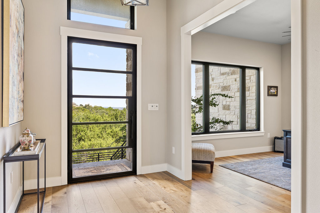 4746 R O Drive Spicewood, TX 78669 - Photo 9 of 40 a view of a room with a window and a hardwood