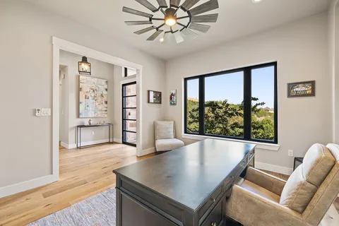 a living room with furniture and a large window
