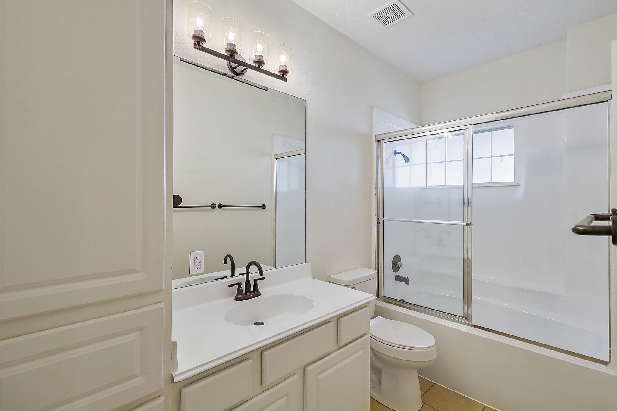 1306 Spring Branch Drive Baytown, TX 77523 - Photo 18 of 38 a bathroom with a sink toilet and shower