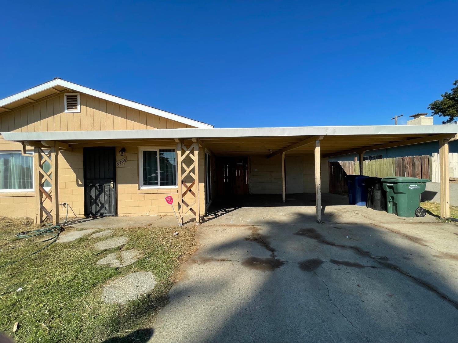 a house with yard in front of it