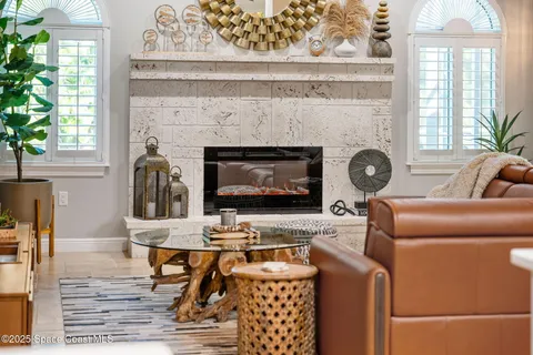 a view of a dining area with furniture and a large mirror