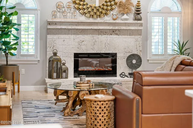 a view of a dining area with furniture and a large mirror