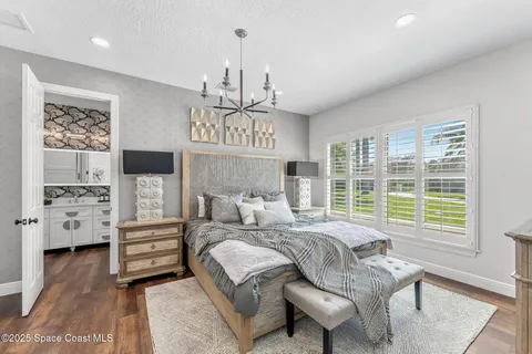 a kitchen with granite countertop wooden cabinets and sink