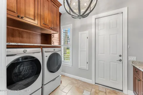 a spacious bathroom with a tub sink and mirror