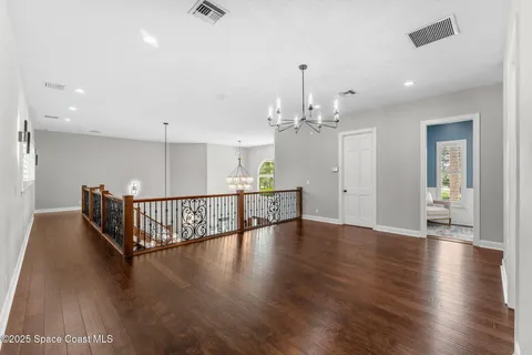 a view of a livingroom with furniture and a chandelier