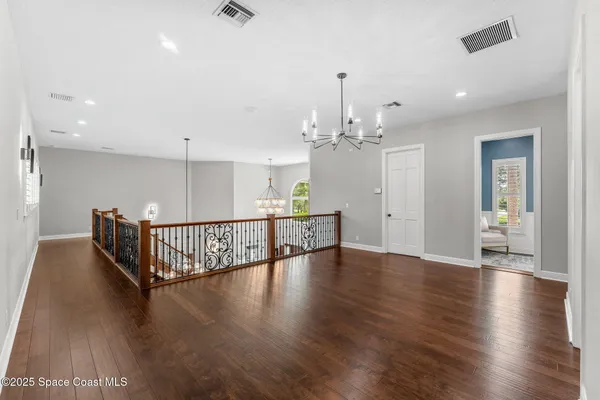 a view of a livingroom with furniture and a chandelier
