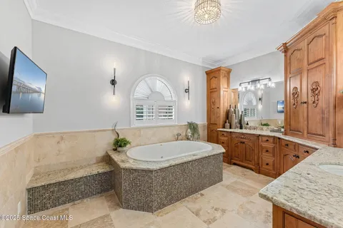 a living room with furniture and a book shelf
