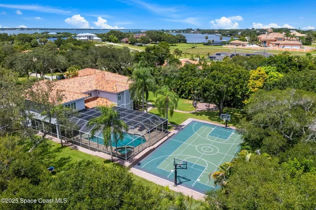a living room with fireplace furniture and a chandelier