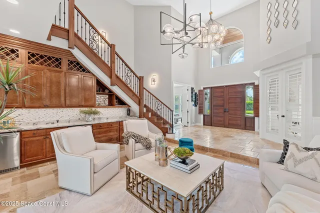 a bathroom with a sink a mirror and a potted plant
