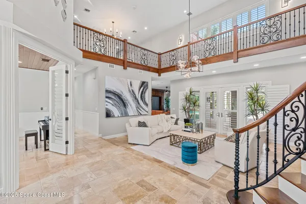 a large kitchen with lots of counter space and furniture