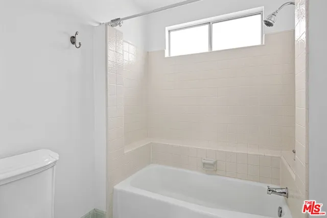 a close up of a bathtub curtain