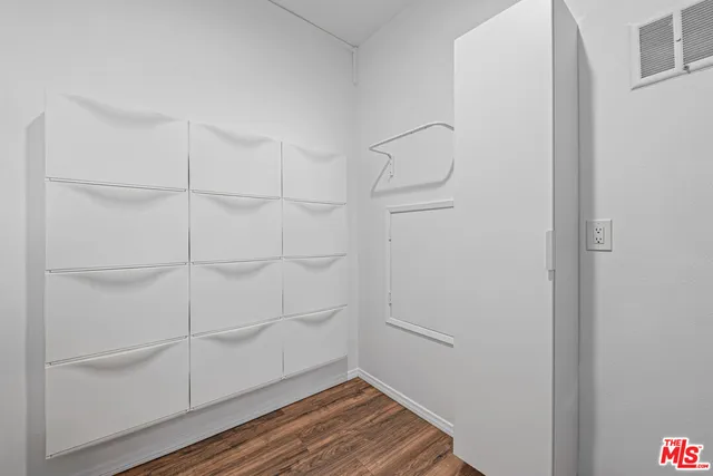 a view of a room with racks on the wall