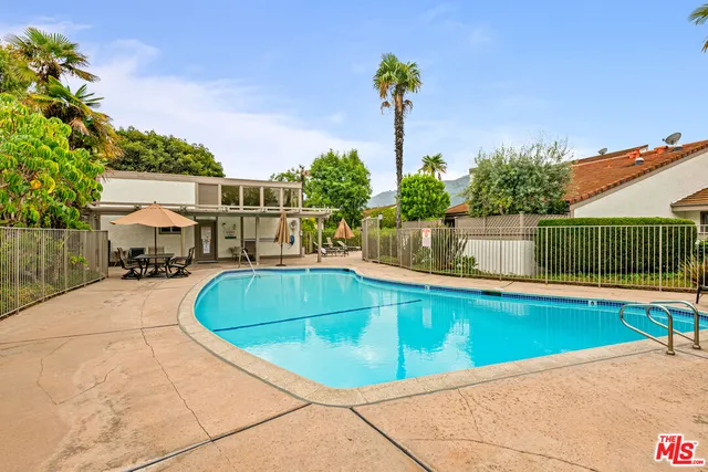 a view of a swimming pool with a patio