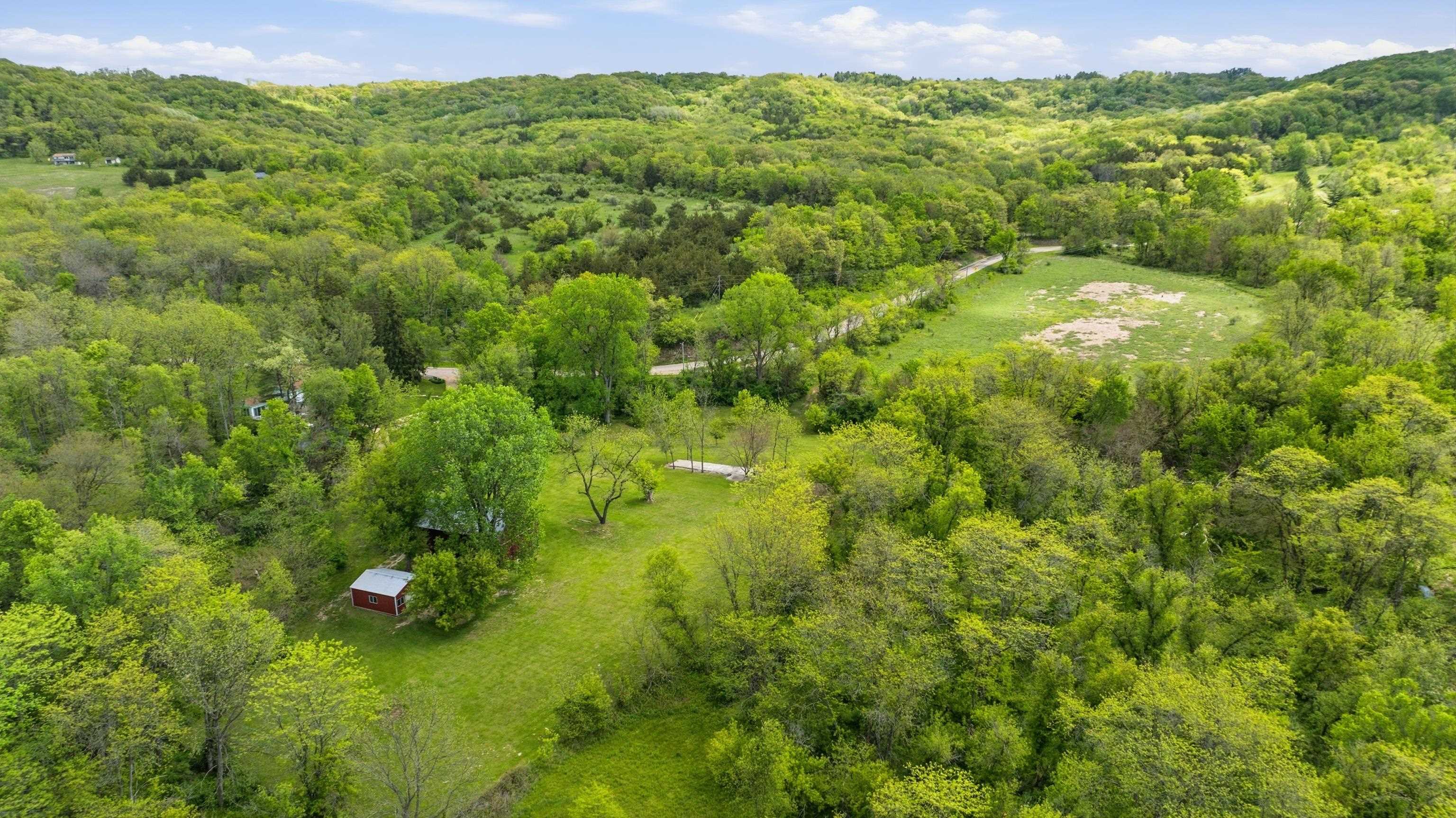 2562 West Blackjack Road Galena, IL 61036 - Photo 66 of 75 a view of a lush green forest with a mountain