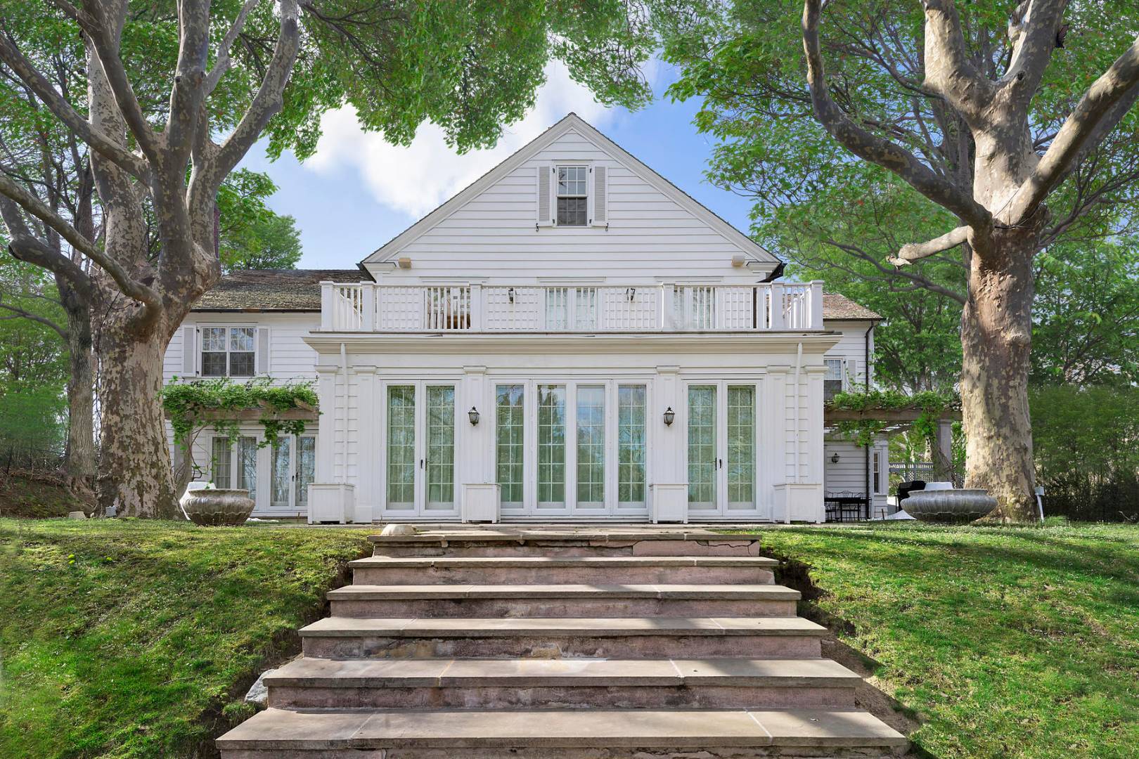 102 Georgica Road East Hampton, NY 11937 - Photo 2 of 17 a view of a house with a yard