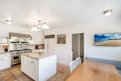102 Georgica Road East Hampton, NY 11937 - Photo 11 of 17 a kitchen with a sink stove and cabinets