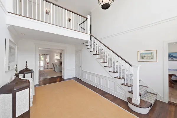 a view of entryway livingroom and hall with wooden floor