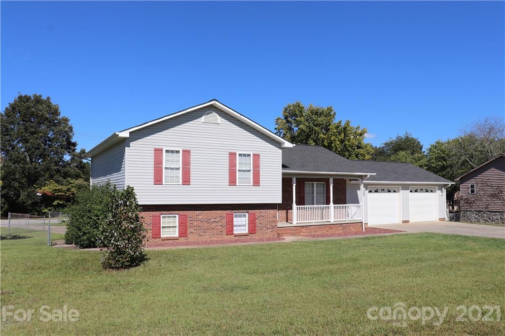 4120 Lower Cedar Valley Road Hudson, NC 28638 - Photo 2 of 48 a front view of a house with garden