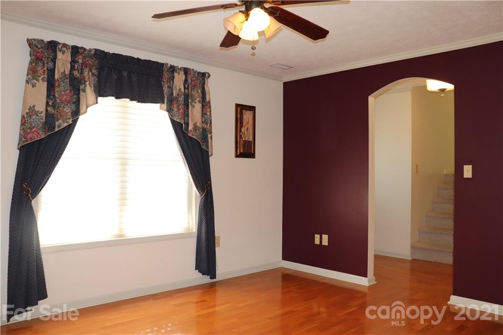 4120 Lower Cedar Valley Road Hudson, NC 28638 - Photo 14 of 48 wooden floor in an empty room with a window