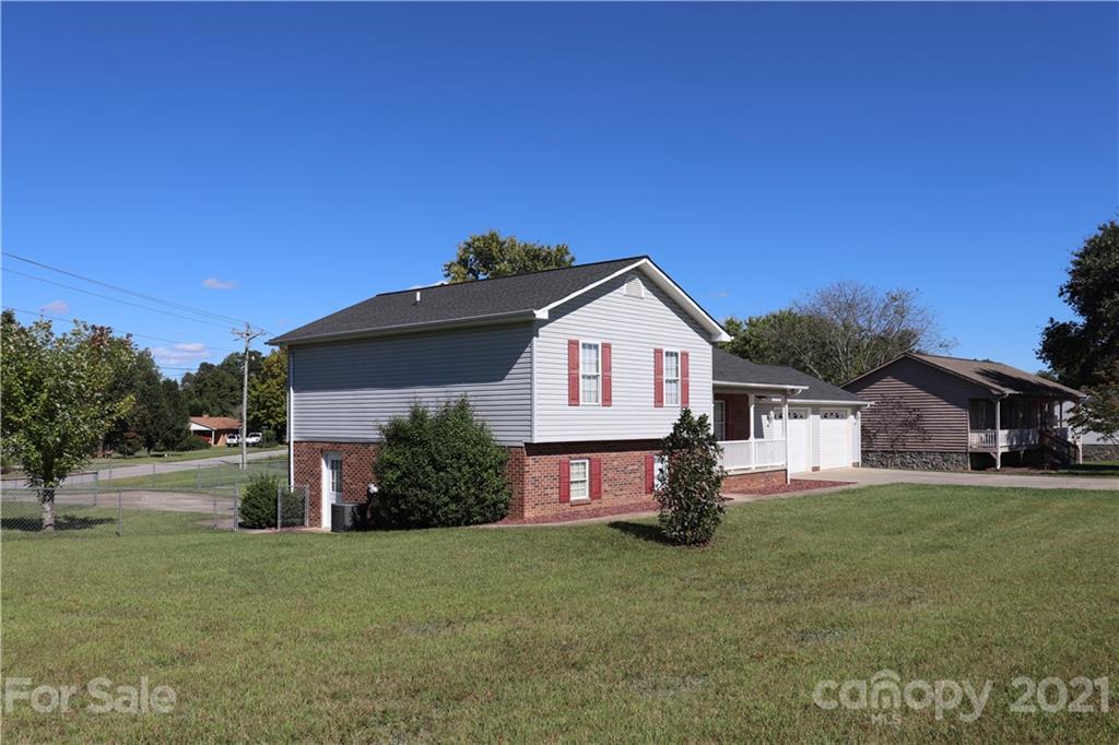 4120 Lower Cedar Valley Road Hudson, NC 28638 - Photo 3 of 48 a front view of a house with a yard