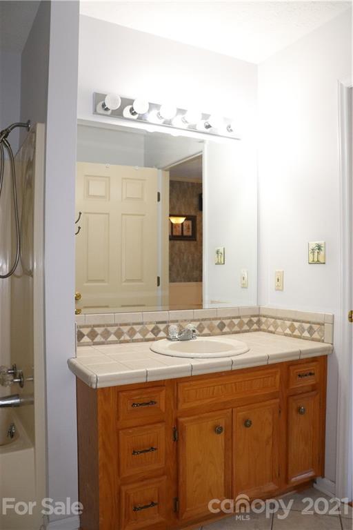 4120 Lower Cedar Valley Road Hudson, NC 28638 - Photo 23 of 48 a bathroom with a sink and a mirror