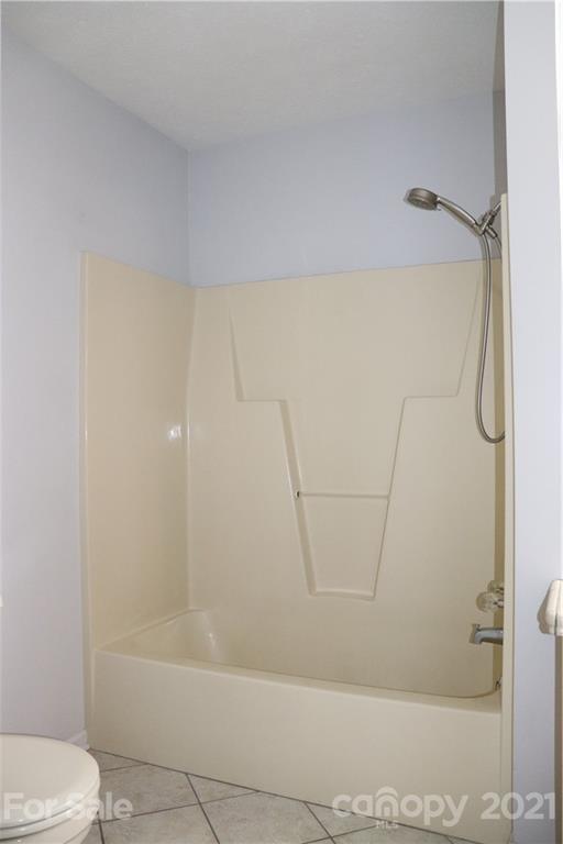 4120 Lower Cedar Valley Road Hudson, NC 28638 - Photo 24 of 48 a bathroom with a shower and a toilet