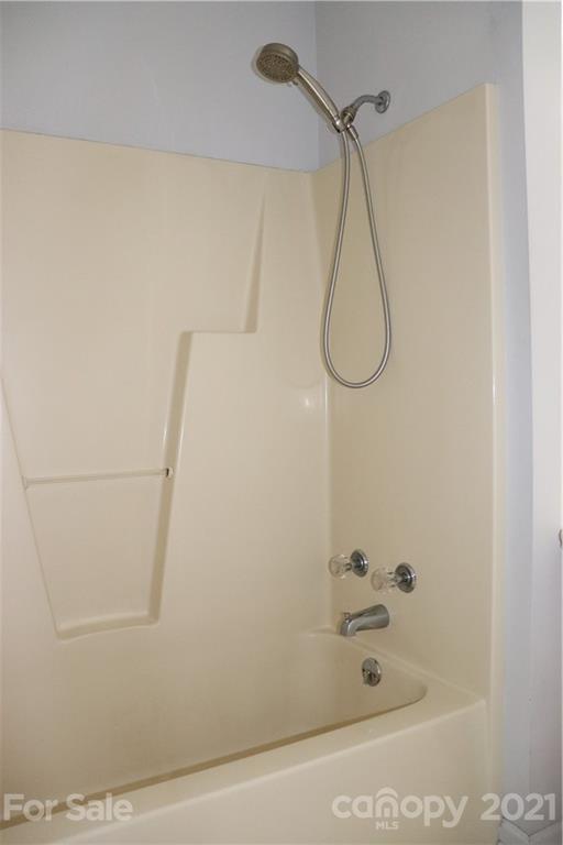 4120 Lower Cedar Valley Road Hudson, NC 28638 - Photo 25 of 48 a bathroom with a bath tub and a shower