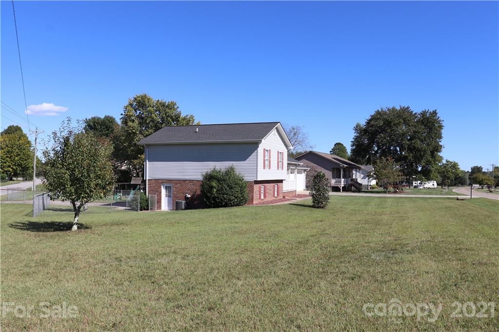 4120 Lower Cedar Valley Road Hudson, NC 28638 - Photo 4 of 48 a front view of a house with a garden