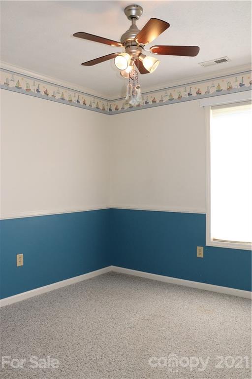 4120 Lower Cedar Valley Road Hudson, NC 28638 - Photo 31 of 48 a view of a room with a ceiling fan and a window