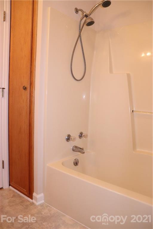 4120 Lower Cedar Valley Road Hudson, NC 28638 - Photo 33 of 48 a bathroom with a bathtub and shower