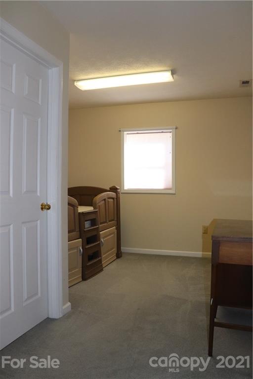 4120 Lower Cedar Valley Road Hudson, NC 28638 - Photo 42 of 48 a view of workspace with flat screen tv