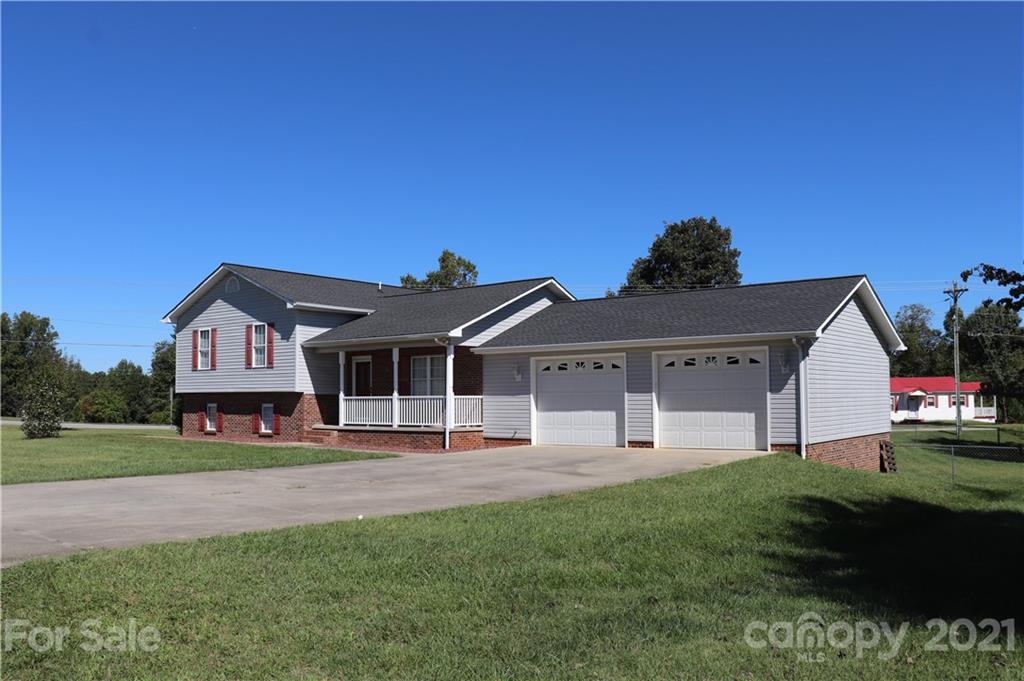 4120 Lower Cedar Valley Road Hudson, NC 28638 - Photo 48 of 48 a front view of a house with a yard