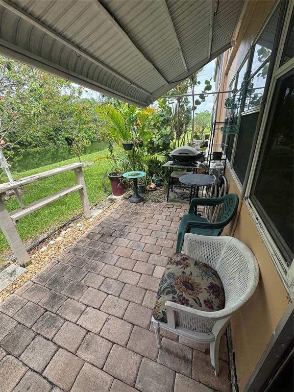 61 Camden C, Unit C West Palm Beach, FL 33417 - Photo 18 of 23 a garden view with a seating space