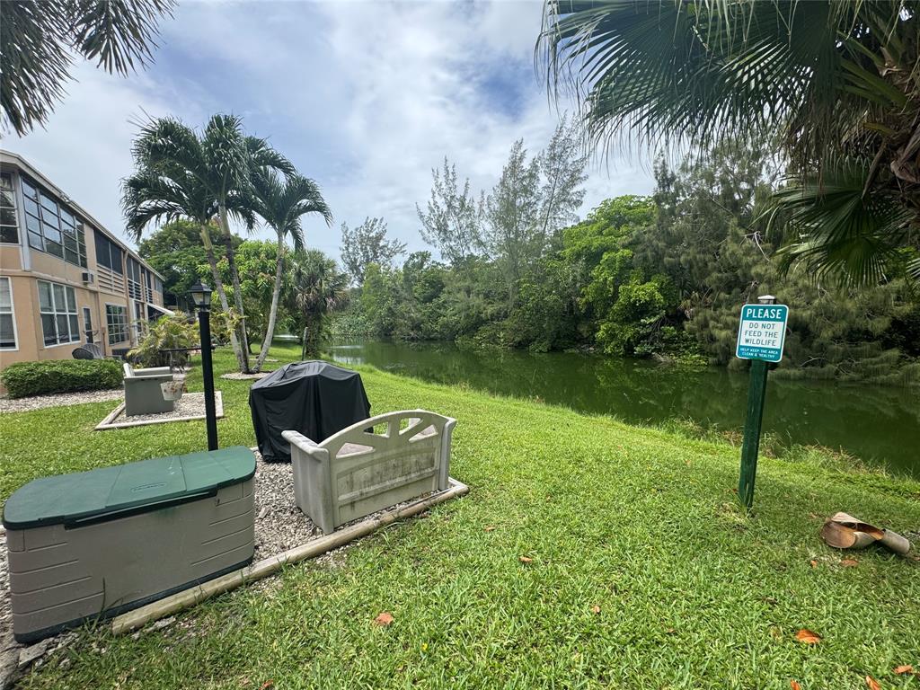 61 Camden C, Unit C West Palm Beach, FL 33417 - Photo 21 of 23 a garden view with a garden