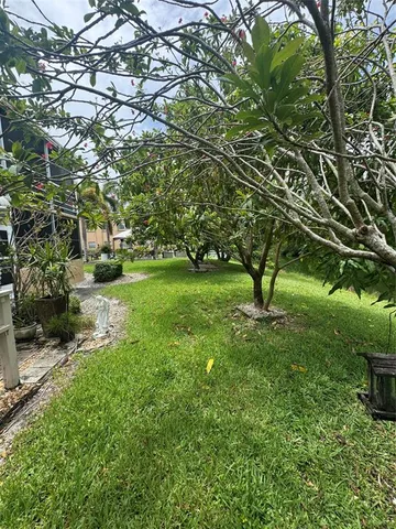 a view of a house with a yard porch and sitting area