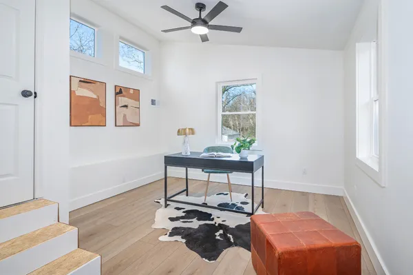 a workspace with furniture and window