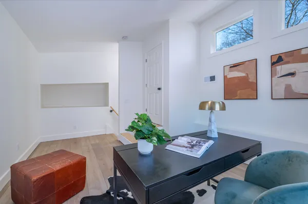 a view of a workspace with furniture