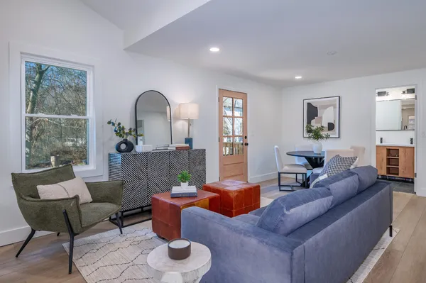 a living room with furniture and a large window